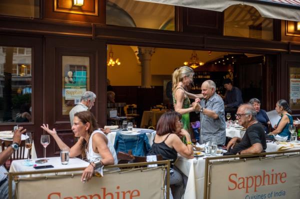 Dancing couple outside a New York restaurant