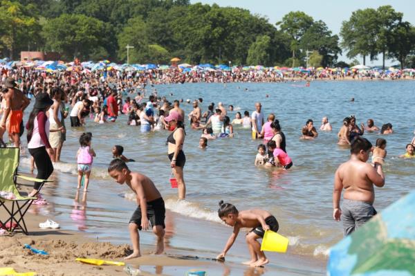 a crowded beach is pictured