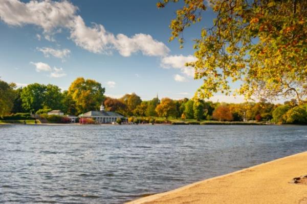 Looking across The Serpentine in London's famous Hyde Park on a day in the fall.