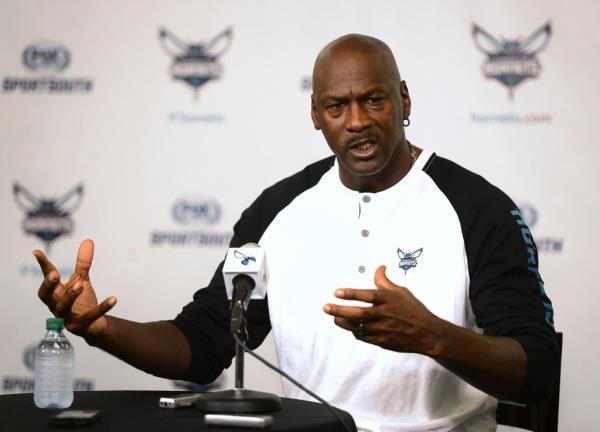 Charlotte Hornets owner Michael Jordan respo<em></em>nds to a question during a news conference