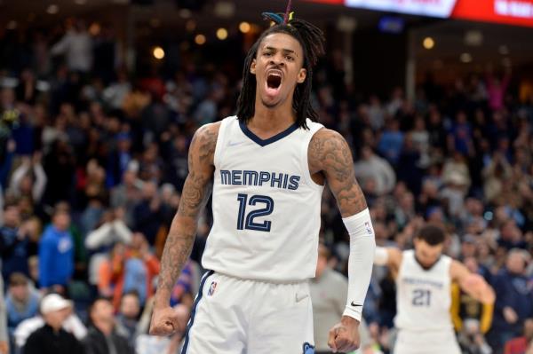 Memphis Grizzlies guard Ja Morant (12) reacts during the second half of the team'ss NBA basketball game against the New York Knicks on Friday, March 11, 2022