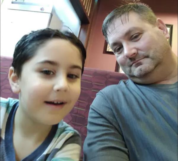 Robert Dobbs is pictured with one of his sons.