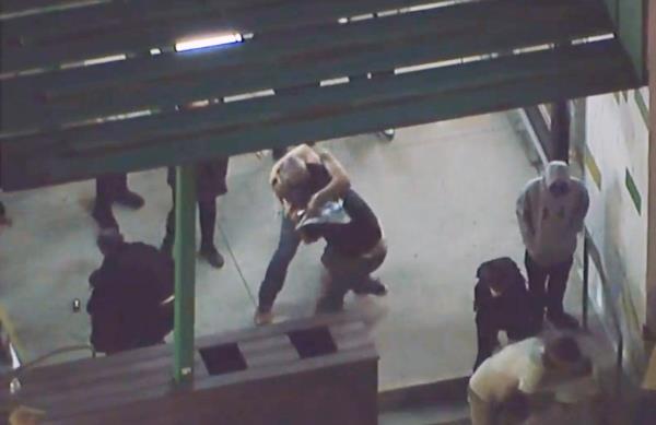 A pro-Israel protester is seen brawling with a pro-Palestinian protester.