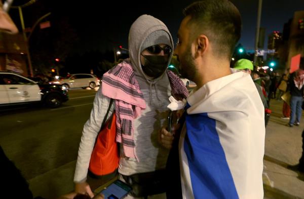 Los Angeles, CA -Pro-Palestininan supporter faces of a pro-Israeli supporter.