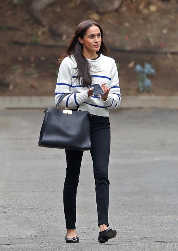 Markle walks into her appointment.