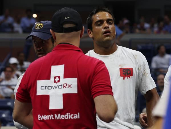 A fan receives medical attention in the stands