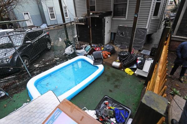 Debris litters the backyard of the Bronx home.