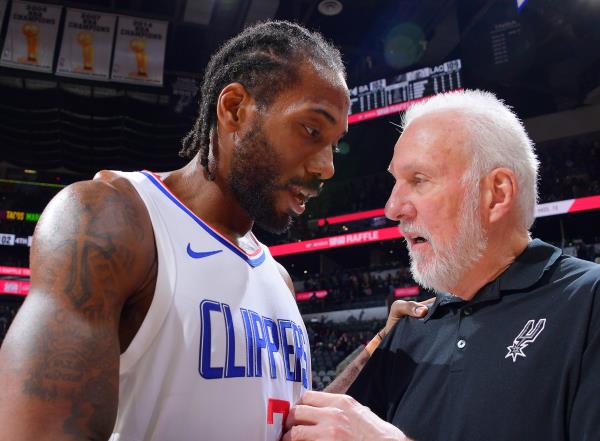 Kawhi Leo<em></em>nard #2 of the LA Clippers talks to Head Coach Gregg Popovich of the San Anto<em></em>nio Spurs after the game on November 22