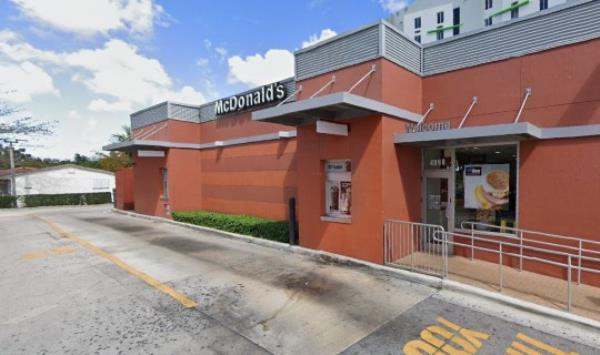 A man got into an argument with a manager at the drive-thru and drove off after allegedly slapping a cup of hot coffee