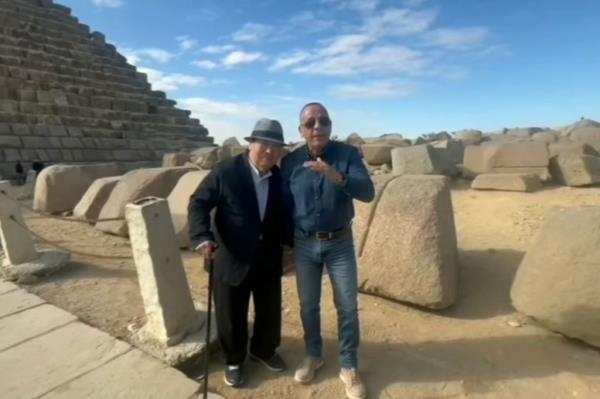 Mostafa Waziri stands outside the pyramid.