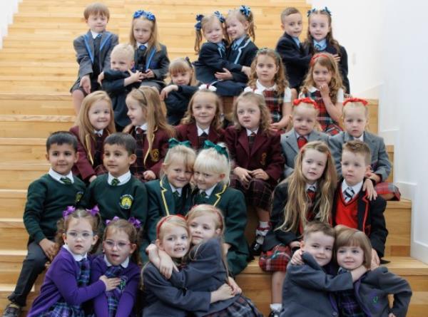 Seventeen sets of twins due to start the new school term in the Inverclyde area pose for a photograph at St Patrick's Primary in Greenock, Inverclyde, ahead of their first day at school. Picture date: Friday August 11, 2023. PA Photo. See PA story EDUCATION Twins. Photo credit should read: Steve Welsh/PA Wire