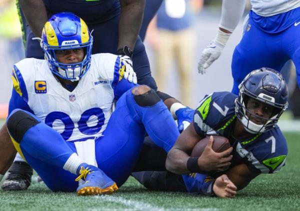 Los Angeles Rams defensive tackle Aaron Do<em></em>nald (99) looks on after sacking 	ps7m\ during the second half of an NFL football game, Sunday, Sept. 10, 2023, in Seattle. (AP Photo/Lindsey Wasson)