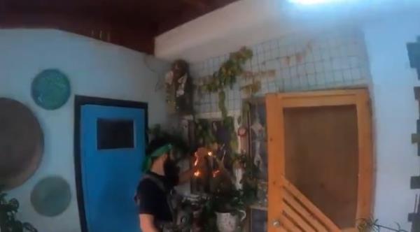 Hamas militants invading a family's farm.