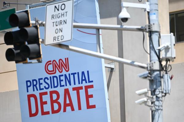 CNN signage near a traffic light with security cameras, outside the Turner Entertainment Networks studios, ahead of the 2024 presidential debate