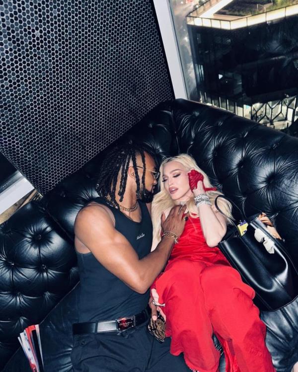 Mado<em></em>nna and Akeem Morris pack on the PDA on Fourth of July in New York City.