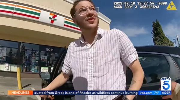 Surveillance video shows Emmet Brock, a transgender man, looking surprised as he was co<em></em>nfronted by LA County Sheriff Deputy Joseph Benza.
