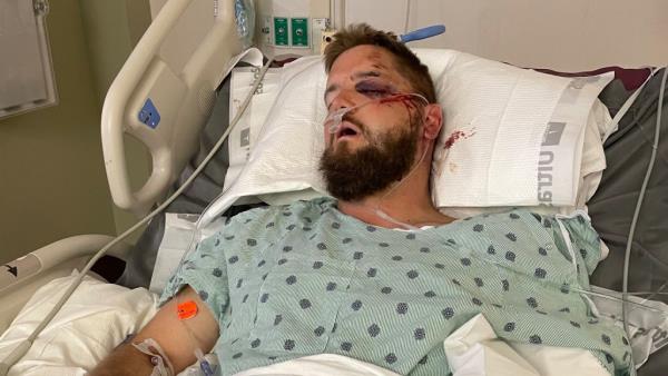 Groom Aric Hutchinson in his hospital bed