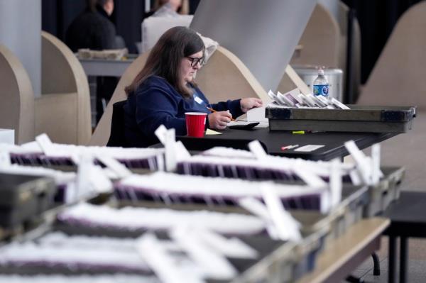 The late ballots have prepaid express return packages for voters.