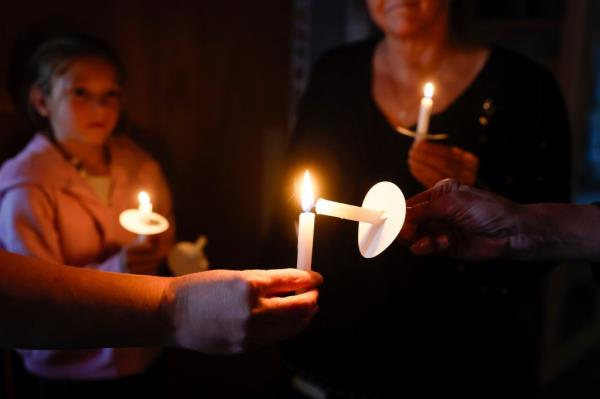 A local pastor held a candlelight vigil for the victims of the shooting Tuesday night.