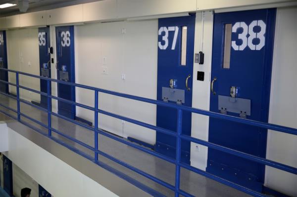 Numbered doors of solitary co<em></em>nfinement unit at Rikers Island jail complex, New York