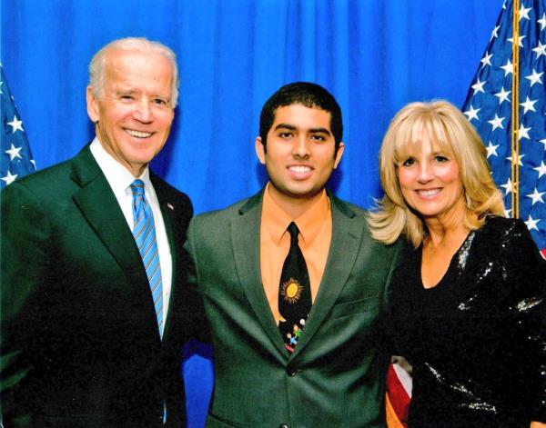 Taral Patel (center) flanked by President Biden and First Lady Jill Biden.