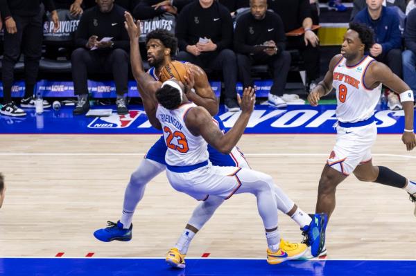 Philadelphia 76ers' Joel Embiid watches from the bench during the second half of an NBA basketball game against the Indiana Pacers, Sunday, Oct. 27, 2024, in Indianapolis.