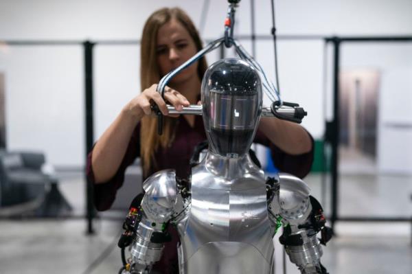 An AI engineer works on humanoid robot.
