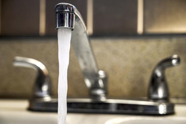 Illustration of running water out of a faucet in a home in Bethpage, New York, on October 15, 2019.