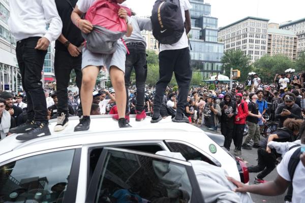 Rioters are seen standing on vehicles amidst Kai Cenat's giveaway at Unio<em></em>n Square