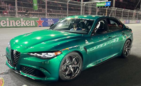 a green car on a race track