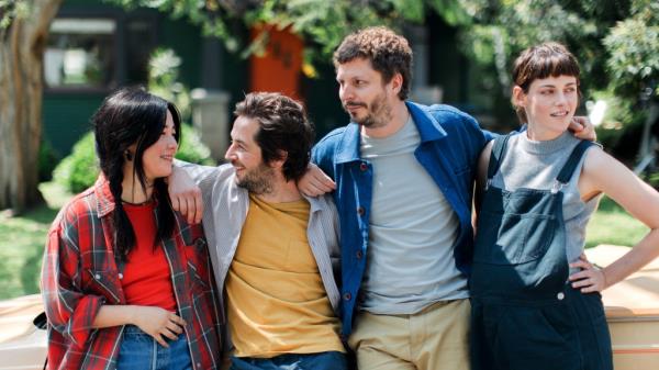 Maya Erskine, Michael Angarano, Michael Cera and Kristen Stewart stand with arms around each other in a still from 