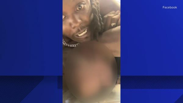 A screenshot from the livestream, showing De'Andre Johnson strangling the DCS worker.