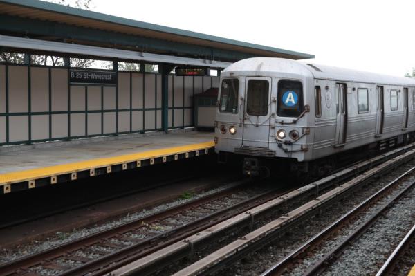 An A train seen on elevated subway tracks in the Rockaways.