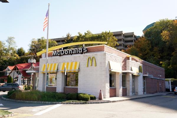 McDonald's sign in Little Falls, NJ with the logo and golden arches on it.