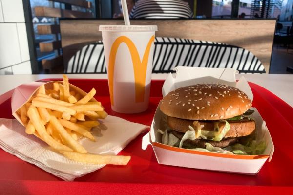 Big Mac meal with fries and Coca-Cola on a red tray at McDonald's in Krakow.