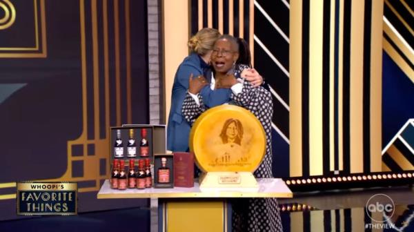 Whoopi Goldberg and cohost Sara Haines embrace on 