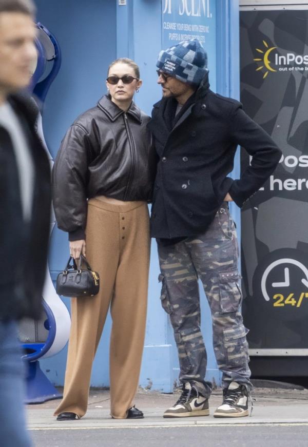 Gigi Hadid and Bradley Cooper are seen holding hands as they take a romantic stroll around Lo<em></em>ndon on Thursday afternoon.