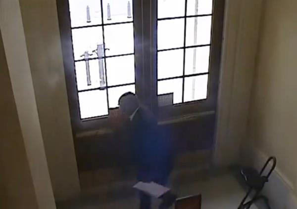 Rep. Bowman pulling the fire alarm in the Cannon House Office Building
