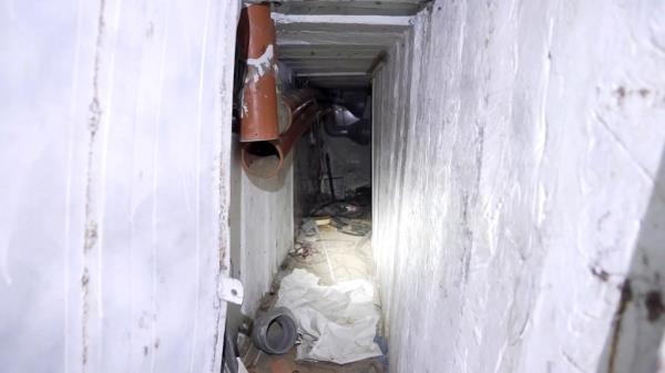 The arched tunnel led to a long, dark stairwell that co<em></em>nnected to multiple corridors and underground rooms.
