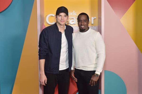 Ashton Kutcher (L) and Sean Combs at a WeWork event in 2019.