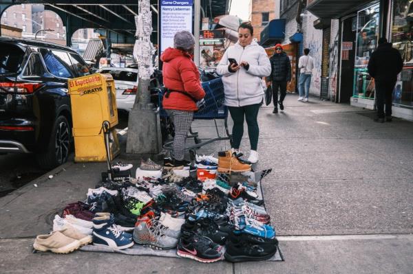 Migrants sell stolen goods in Jackson Heights. 