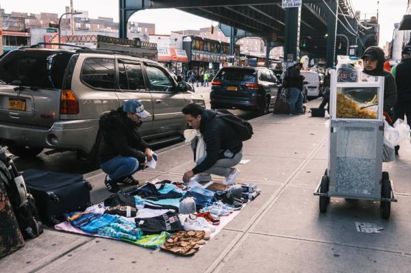 Illegal peddlers on Roosevelt Avenue. 