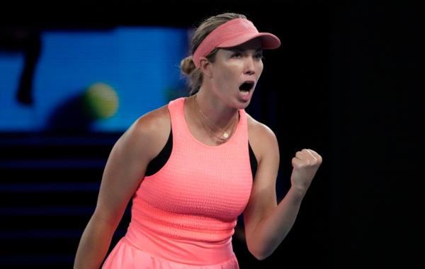 Danielle Collins celebrates after winning a point during her three-set loss to Iga Swiatek in the second round of the Australian Open.
