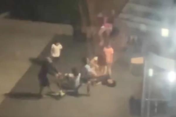 A screenshot from video showing the teens fighting.