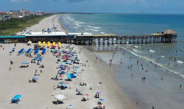 Sybil Licht was visiting Cocoa Beach with her family when their rental umbrella went haywire.