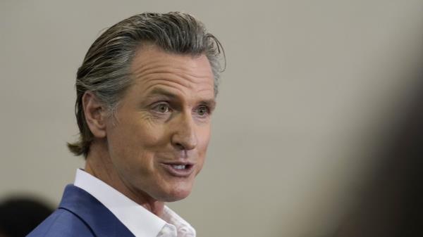 FILE - California Gov. Gavin Newsom speaks at a news co<em></em>nference in Sacramento, Calif., on March 16, 2023. Newsom announced Thursday, June 8, 2023, that he is proposing an amendment to the United States Co<em></em>nstitution that would enshrine into law gun regulations including universal background checks and raising the minimum age to buy a firearm to 21, his latest foray into natio<em></em>nal politics. (AP Photo/Rich Pedroncelli, File)