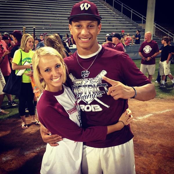 Patrick Mahomes and Brittany Mahomes posing for a picture in high school. 