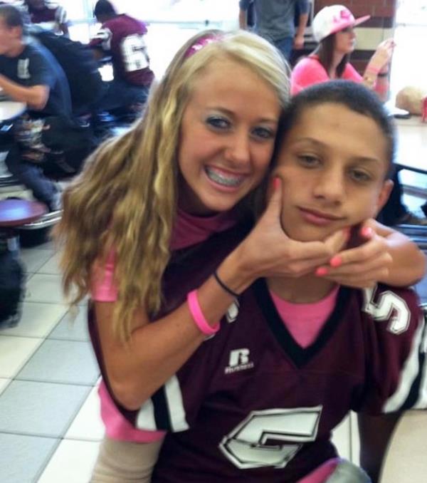 Brittany Mahomes hugging Patrick Mahomes when they were in high school. 