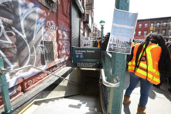 022924 Showing a Reward Poster due to the slashing. Canella Gomez the Vicepresident of Rapid Transit Operation, Richard Davis the Transit Unio<em></em>n Chief and John Chiarello the Director of Safety and Treasurer, held a Press co<em></em>nference at the A-Line Subway station at the corner of Fulton Street and Rockaway Avenue in Brooklyn, NY.  Motorman Alton Scott, 59 years old, was slashed their this morning. 