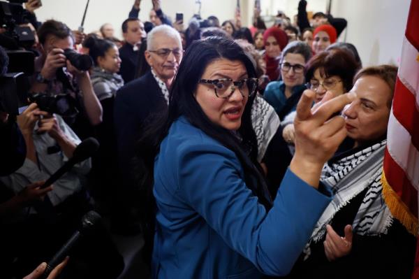 Rep. Rashida Tlaib (D-MI) greets demo<em></em>nstrators with Code Pink for Peace outside her office in the Rayburn House Office Building as they rallied on Capitol Hill in support of Palestinians and to demand a cease fire in Gaza on February 15.